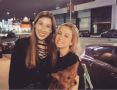 friend and Iliza holding her dog