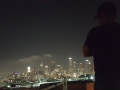 dévyan looking over the nighttime downtown los angeles city scape
